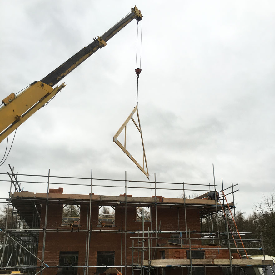 Roof Trusses Being Placed on New House